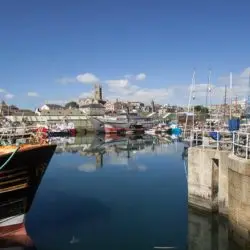 dovemeadows-penzance-1-full Penzance harbour on a still, sunny day